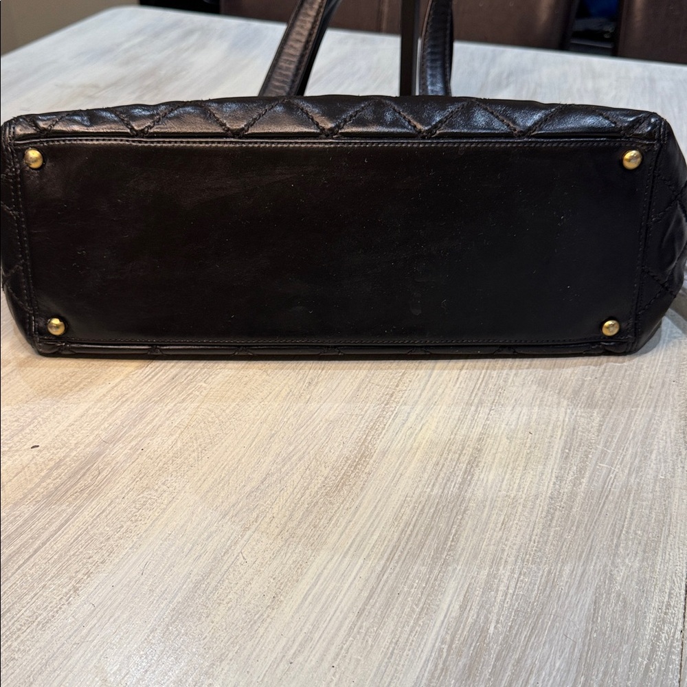CHANEL Black Quilted Handbag with Gold Accent - Picture 11 of 13